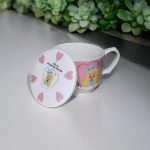 Alice In Wonderland Porcelain Mug with the lid open and put on it's side