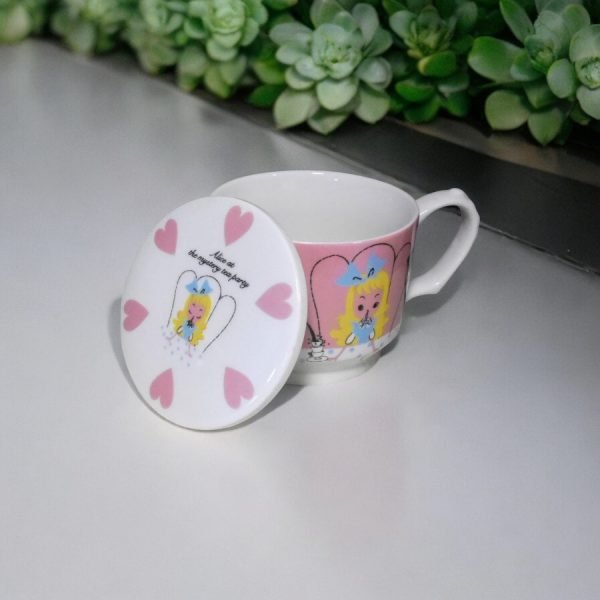 Alice In Wonderland Porcelain Mug with the lid open and put on it's side